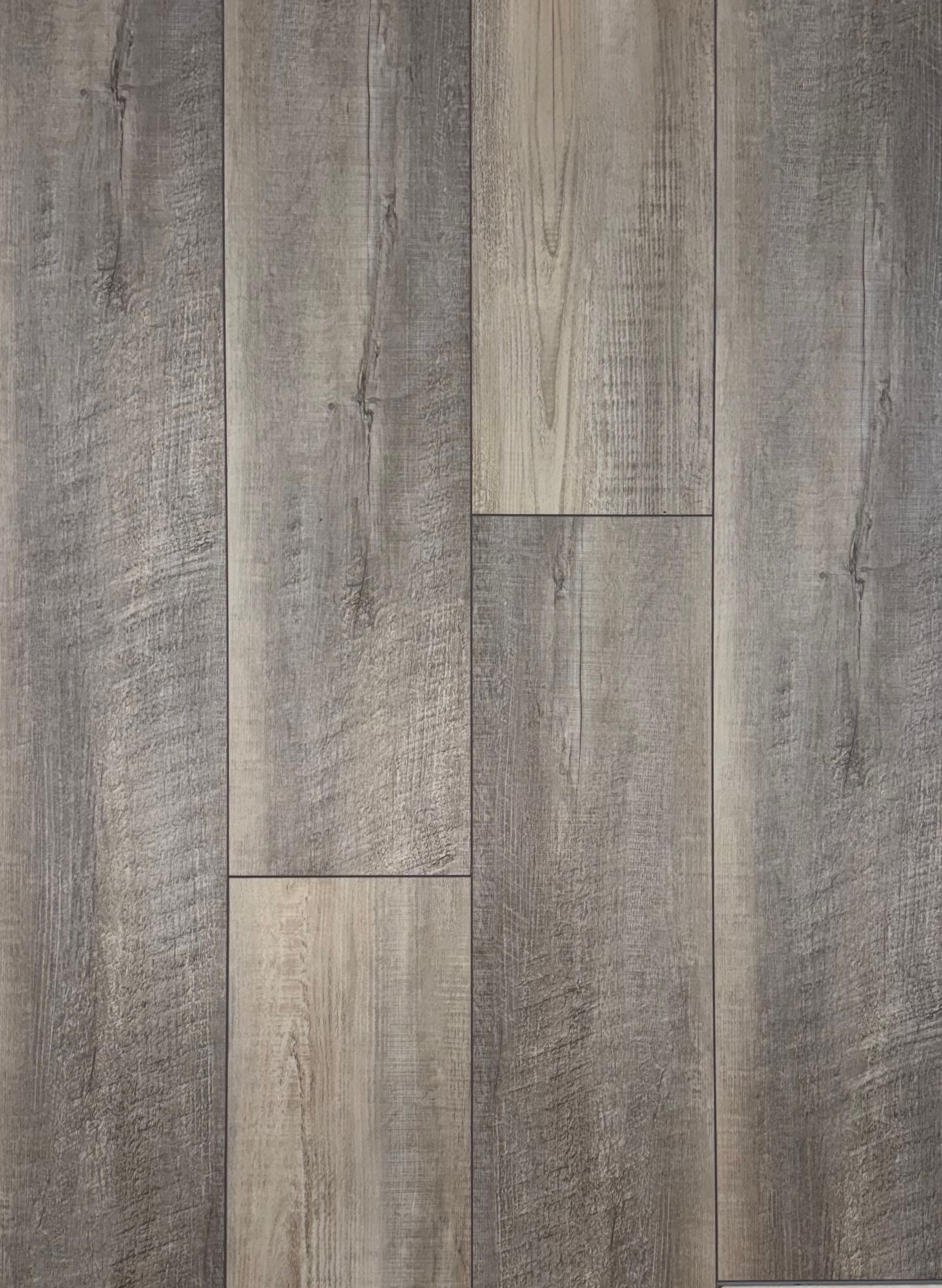 A close up of a wooden floor with a gray grain.