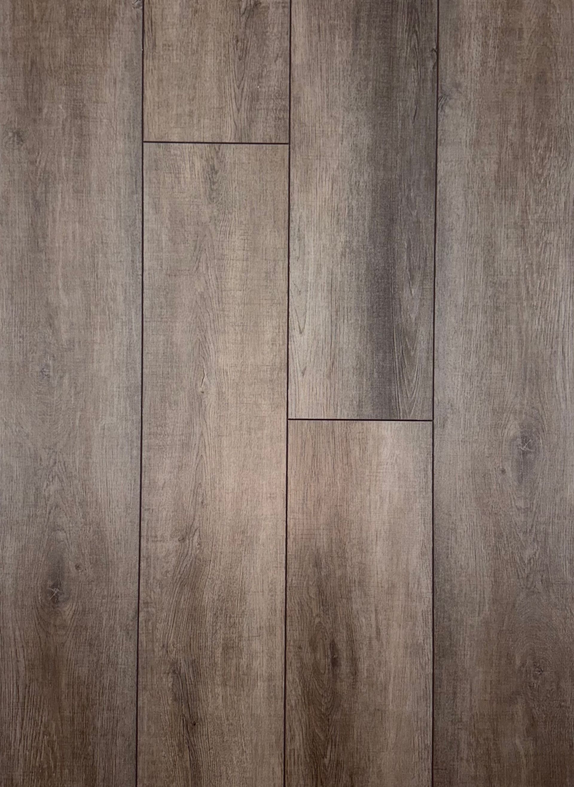 A close up of a wooden floor with a grainy texture.