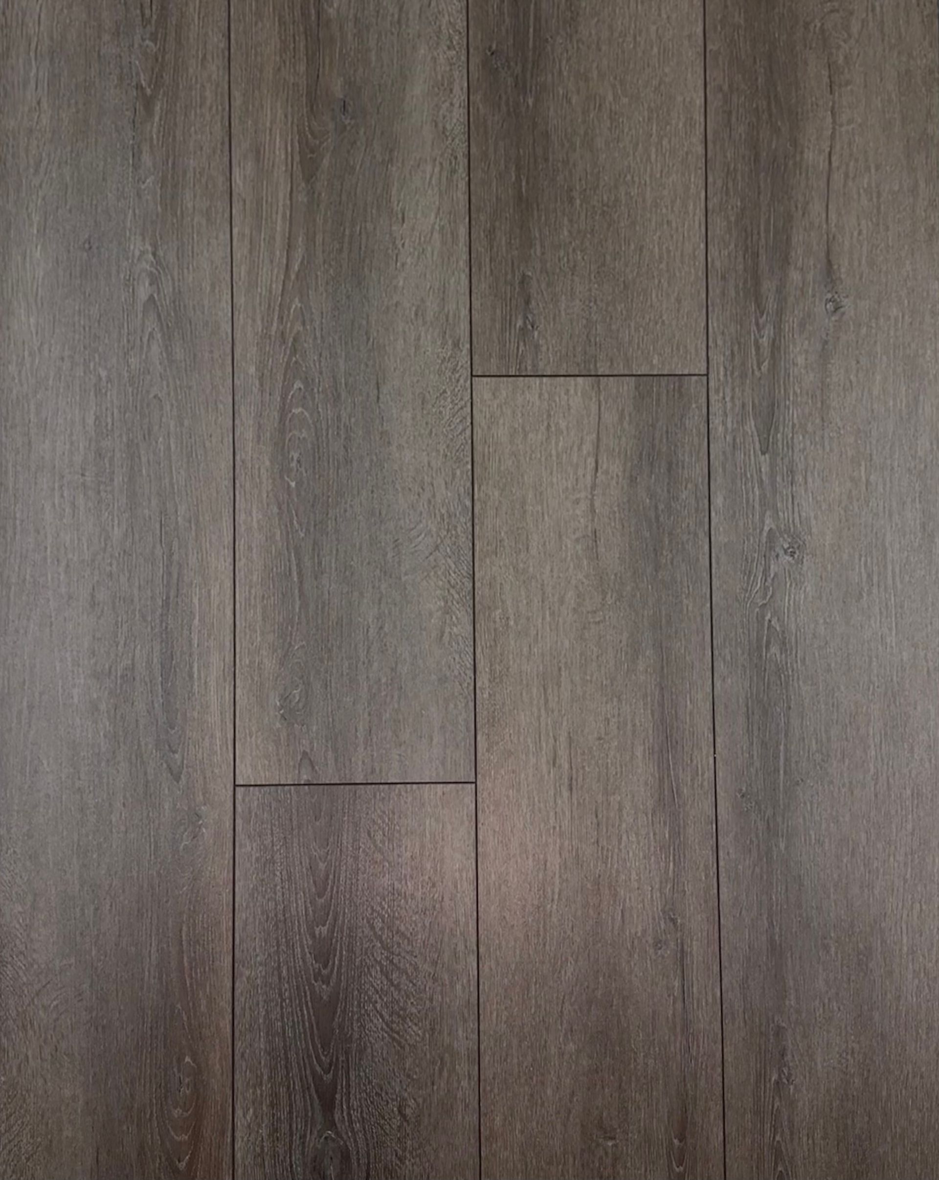 A close up of a wooden floor with a grainy texture.