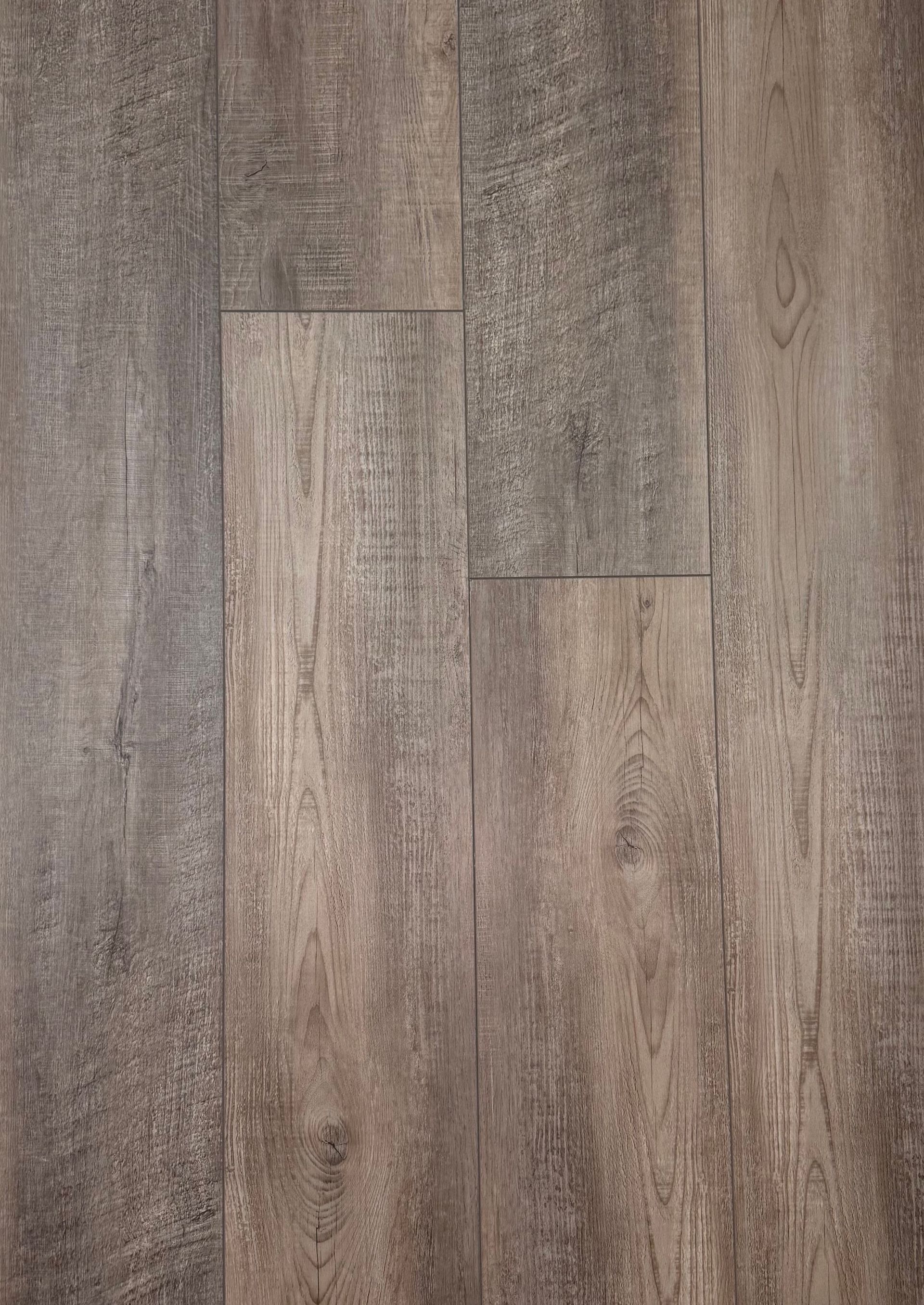 A close up of a wooden floor with a grainy texture.