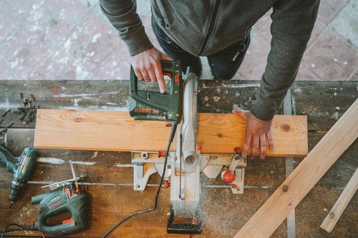 carpenter cutting wood in workshop pemberton
