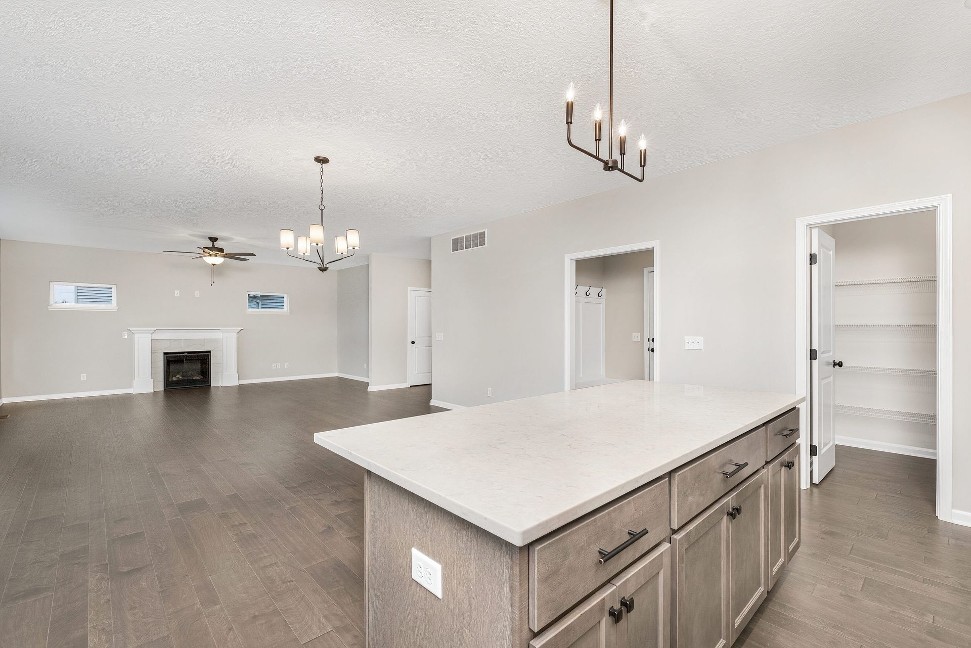 There is a large island in the middle of the kitchen.