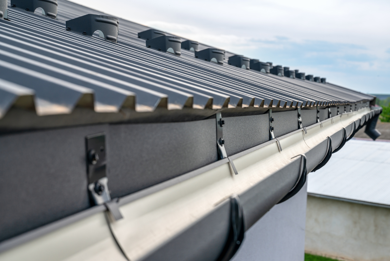 Black clean gutter being installed