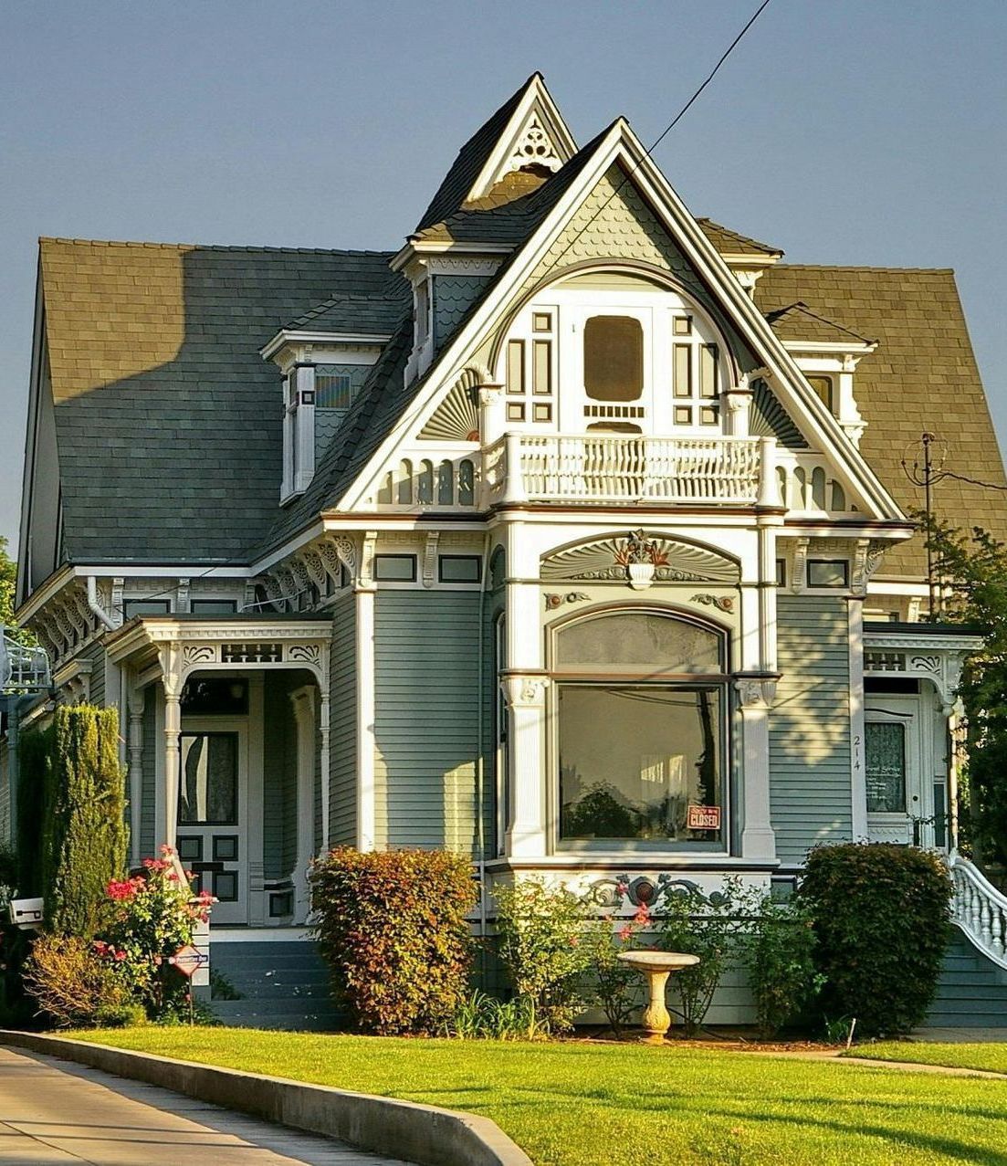 A large white house with a gray roof