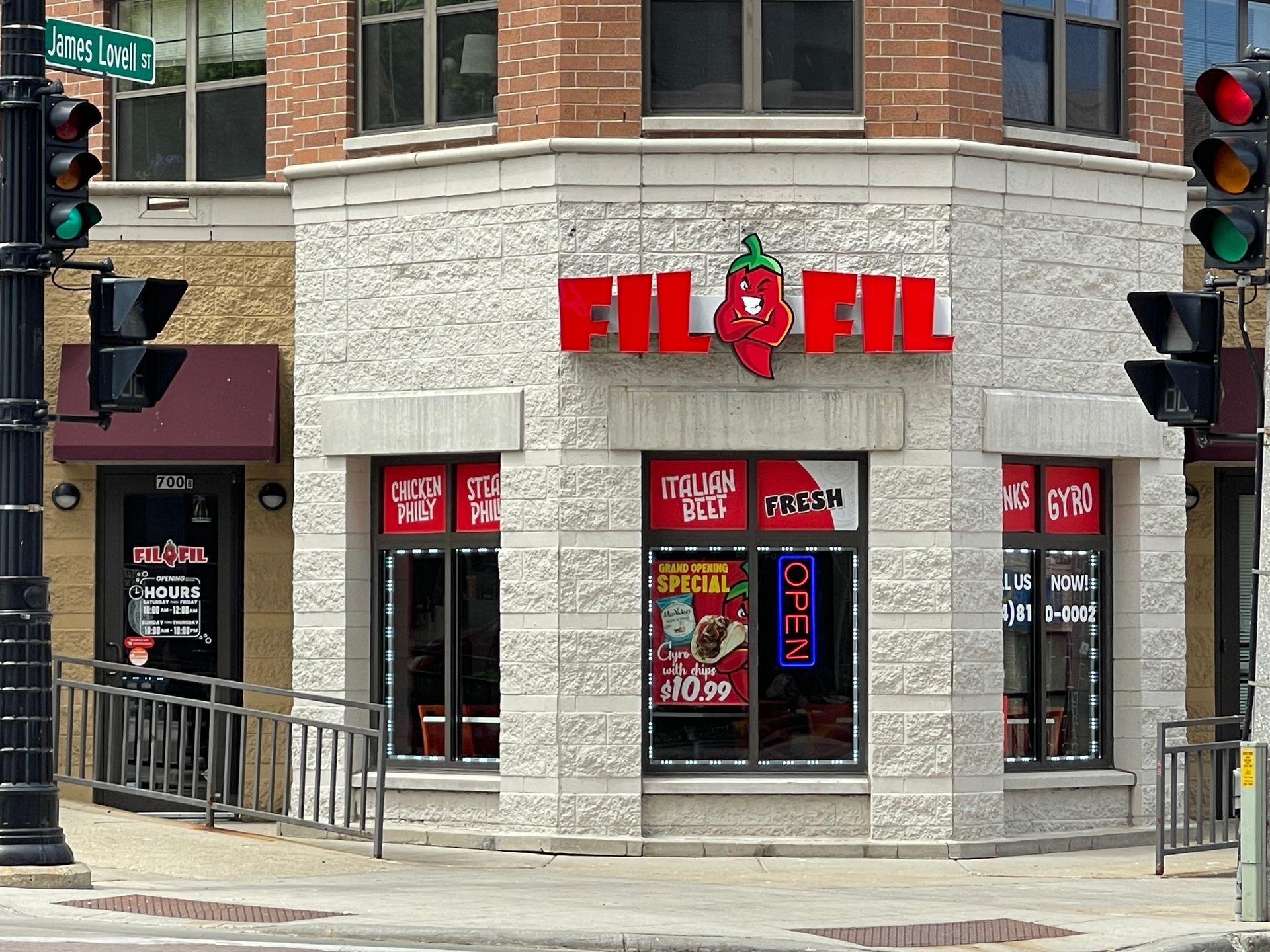 A fil fil restaurant is located on the corner of a city street