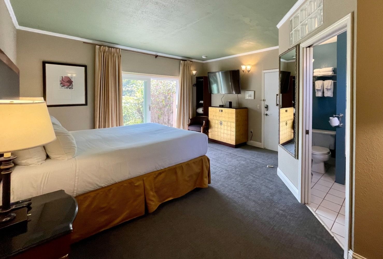 There is a large bed in the middle of the room.