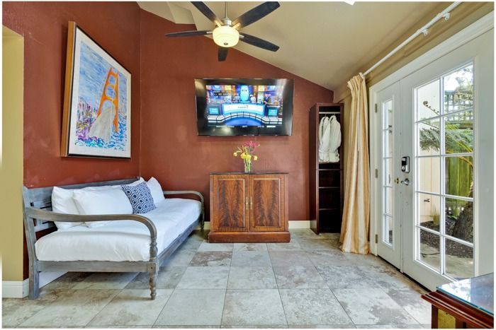 A living room with a couch and a flat screen tv