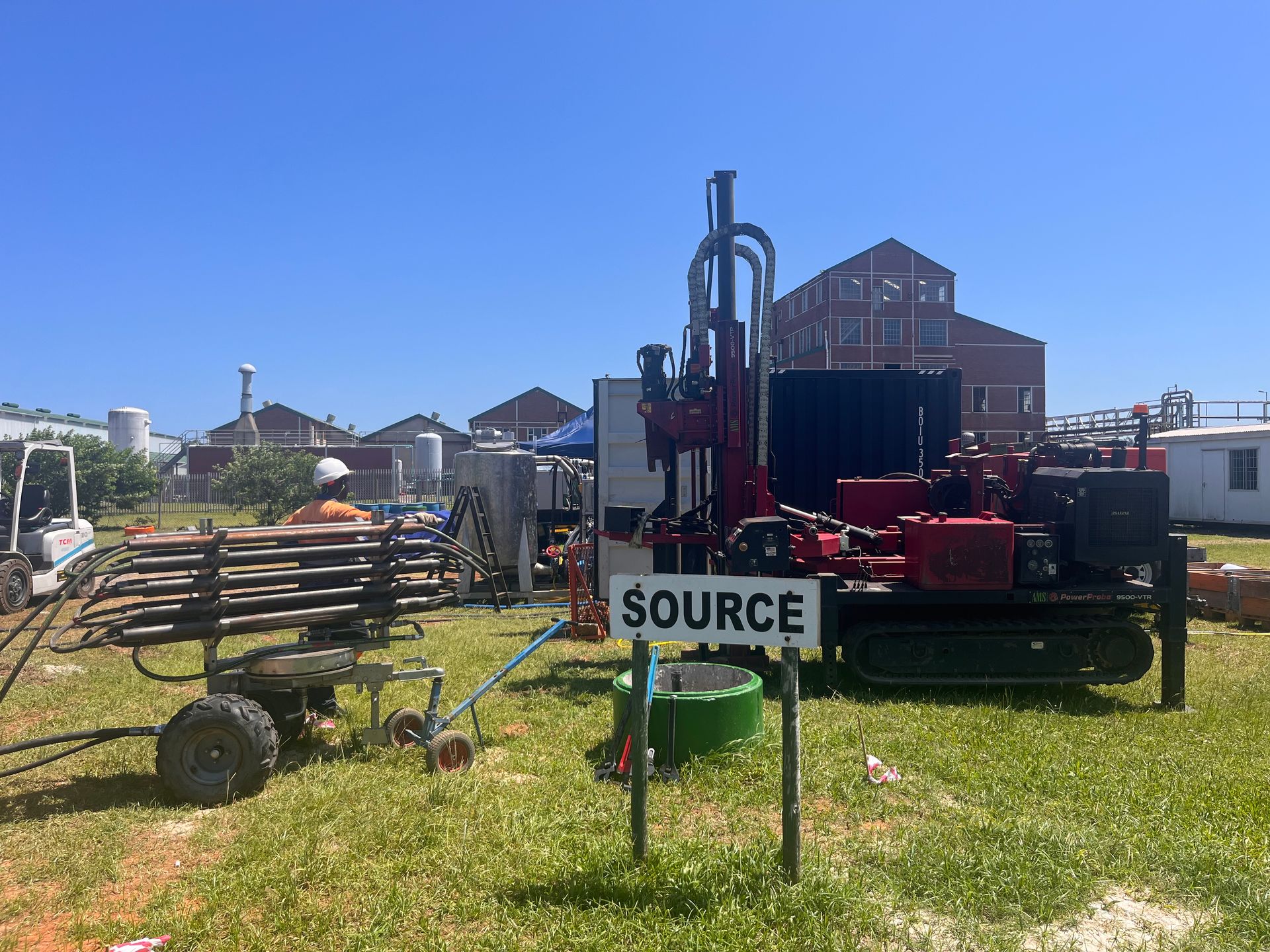 Drilling rig on green grass,