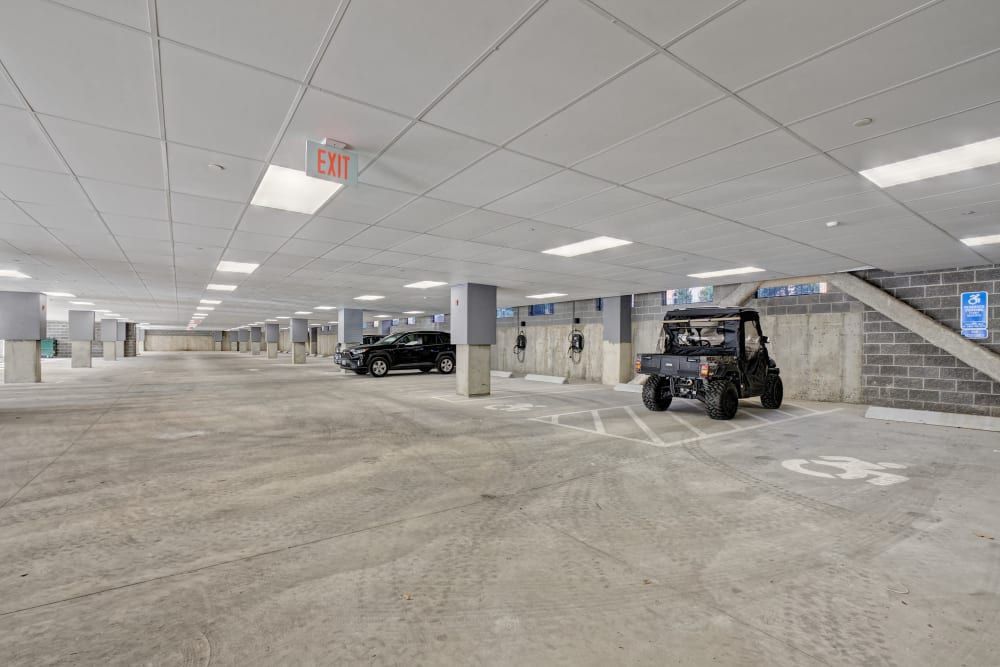A buggy is parked in a parking garage.