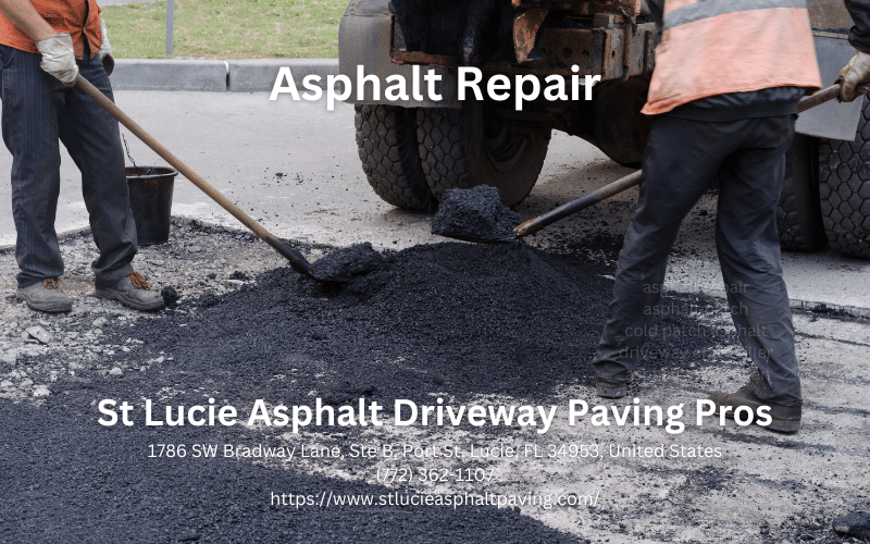 worker leveling fresh asphalt on a road construction
