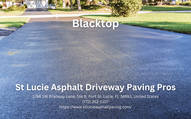 worker leveling fresh asphalt on a road construction