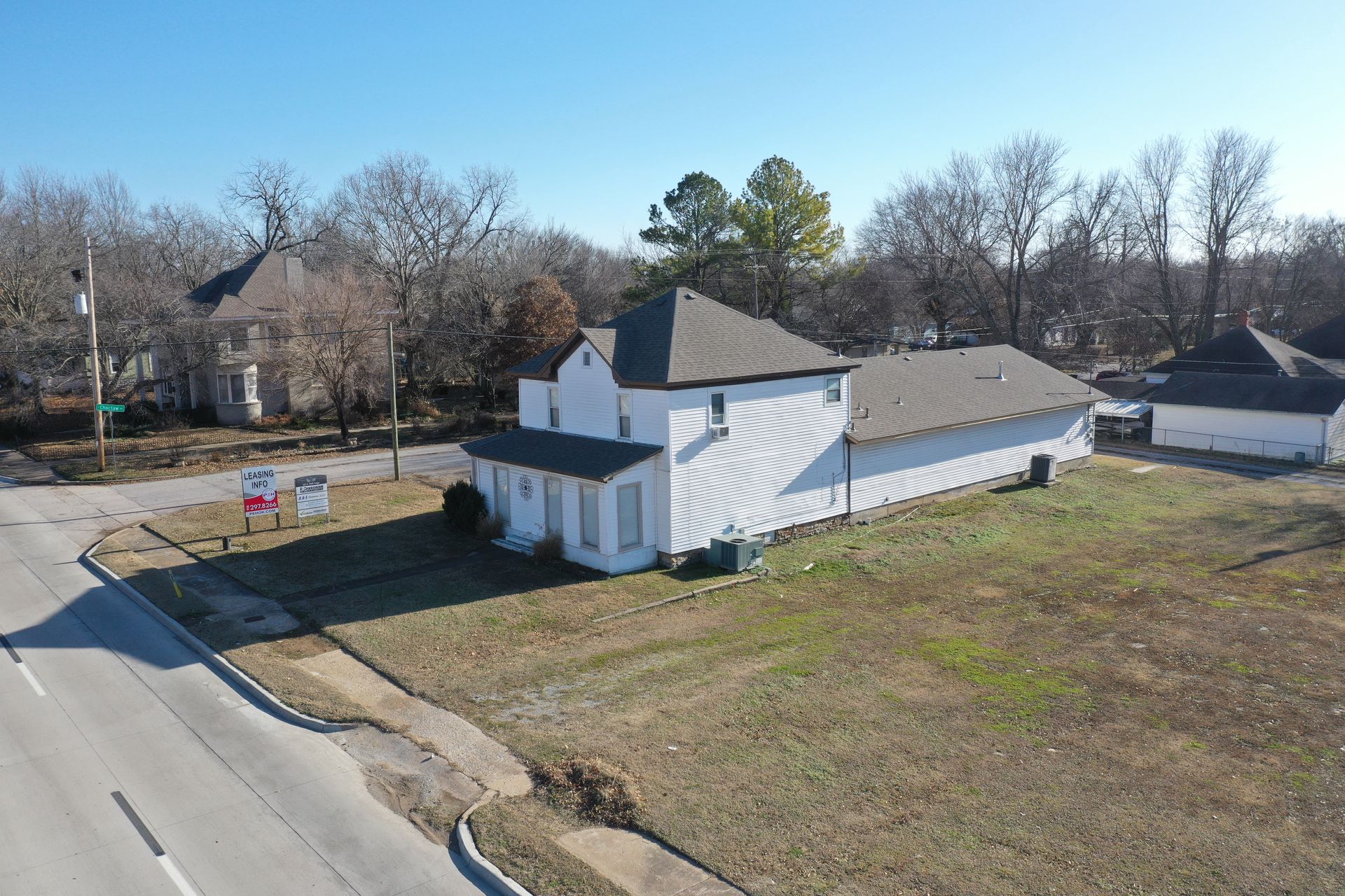 an aerial view of a house in a small town