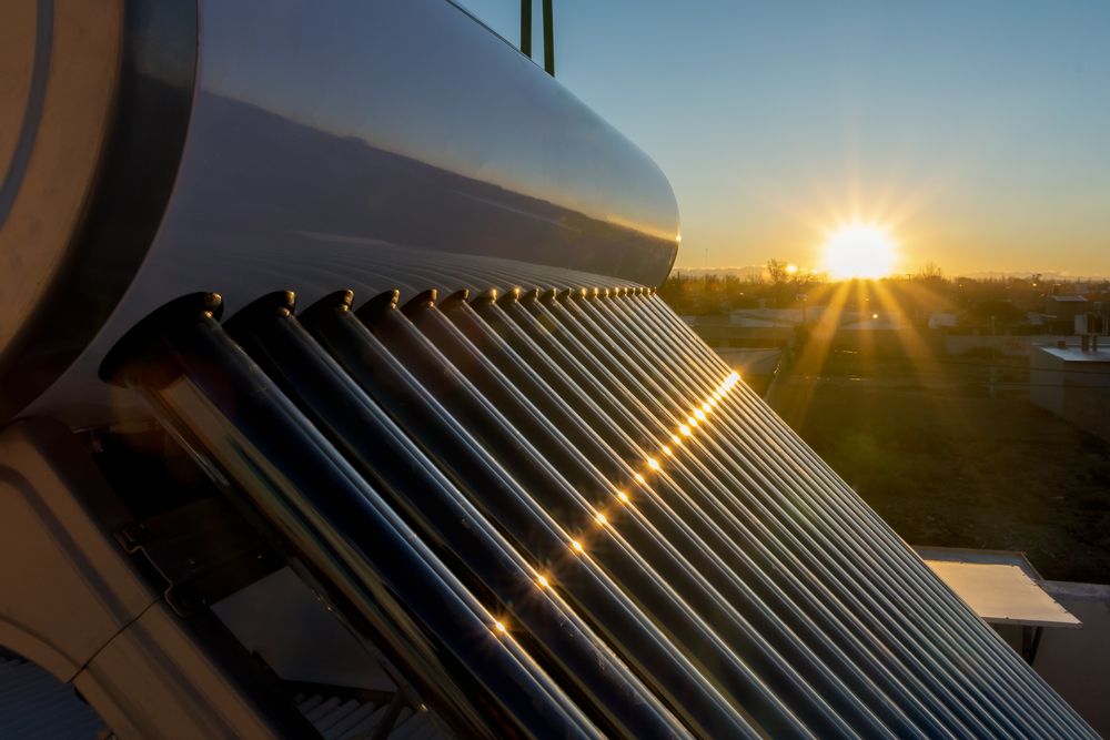 The Sun is Shining Through the Pipes of a Solar Water Heater — Absolute Plumbing Australia in Howard Spring, NT