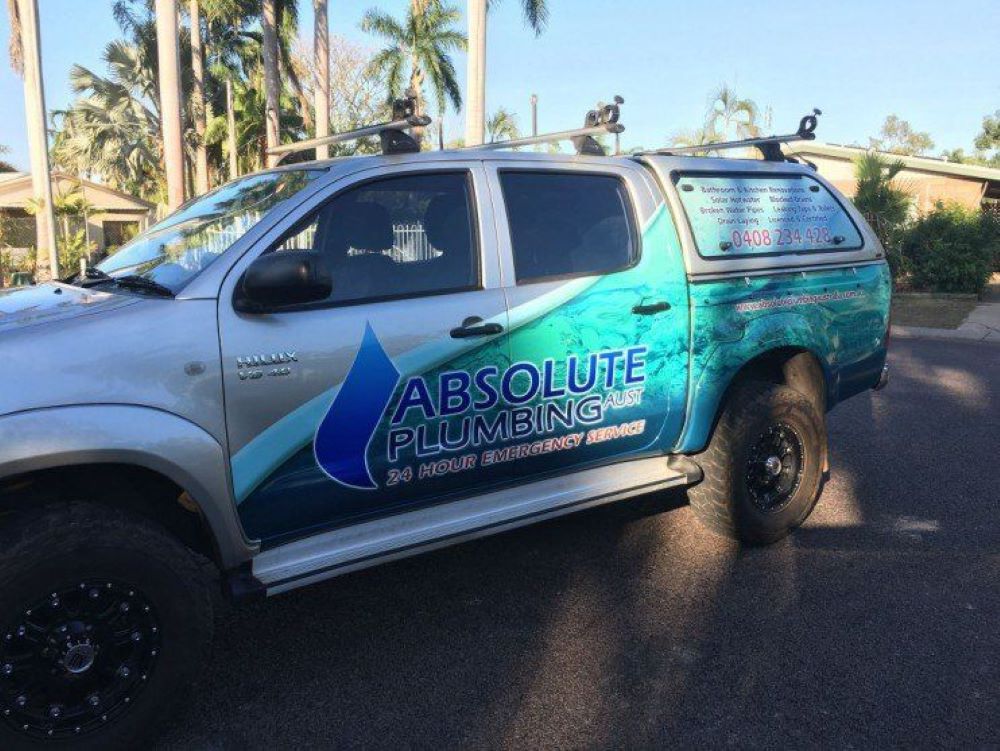 An Absolute Plumbing Truck is Parked on the Side of the Road — Absolute Plumbing Australia in Howard Spring, NT