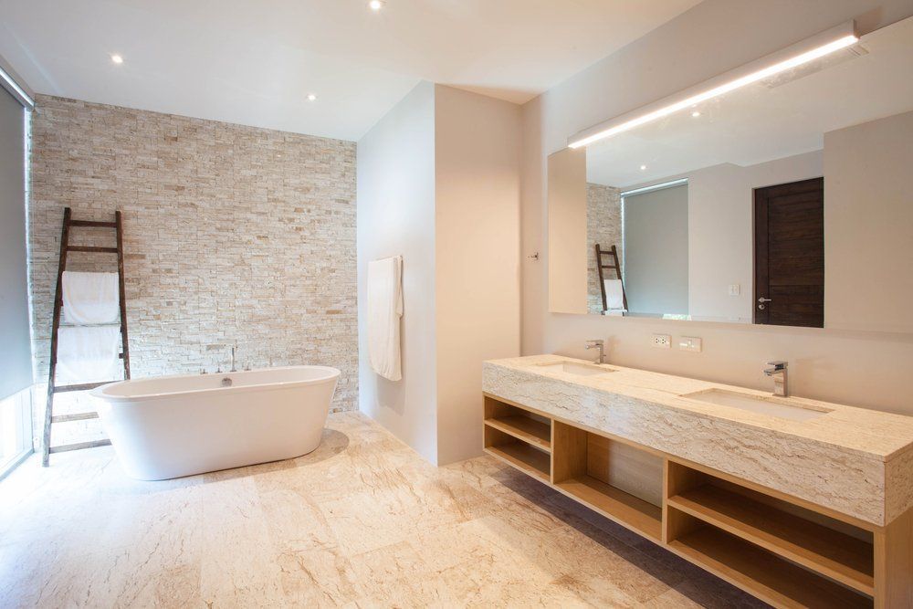 A Bathroom With Two Sinks and a Bathtub — Absolute Plumbing Australia in Leanyer, NT