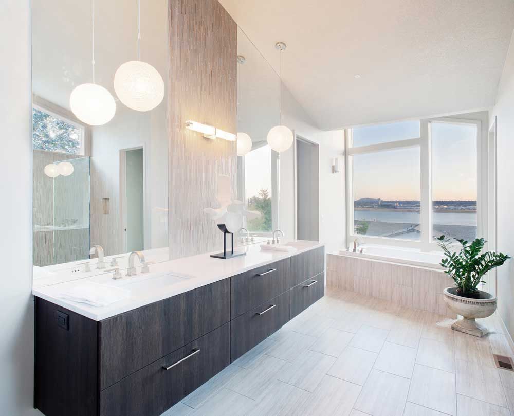 A Bathroom With Two Sinks, a Tub and a Large Mirror — Absolute Plumbing Australia in Darwin, NT