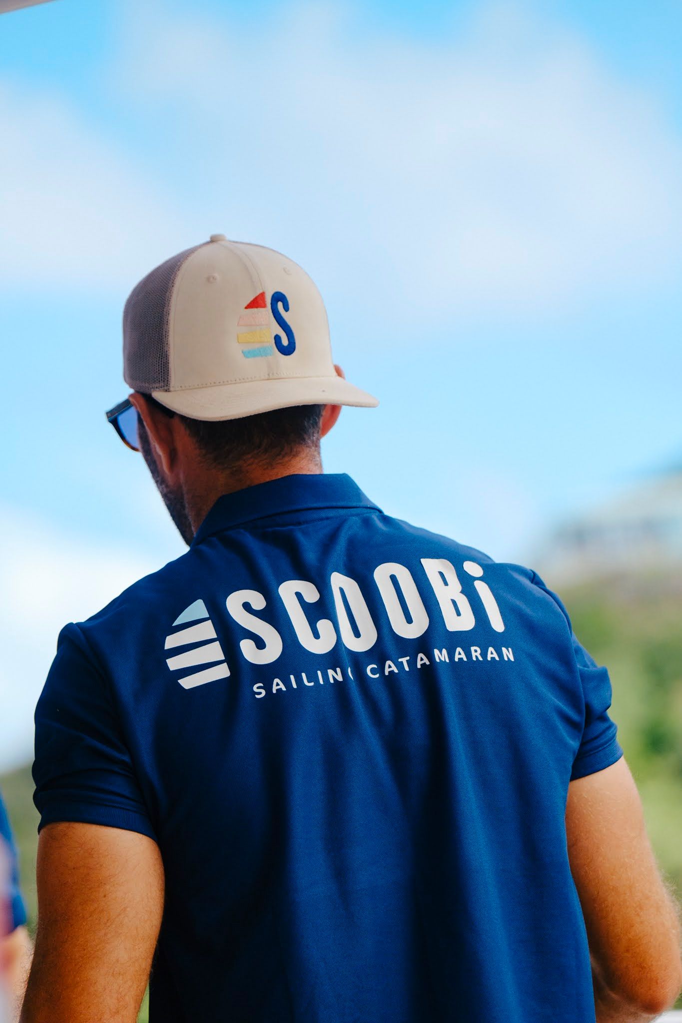 Person wearing blue polo with 