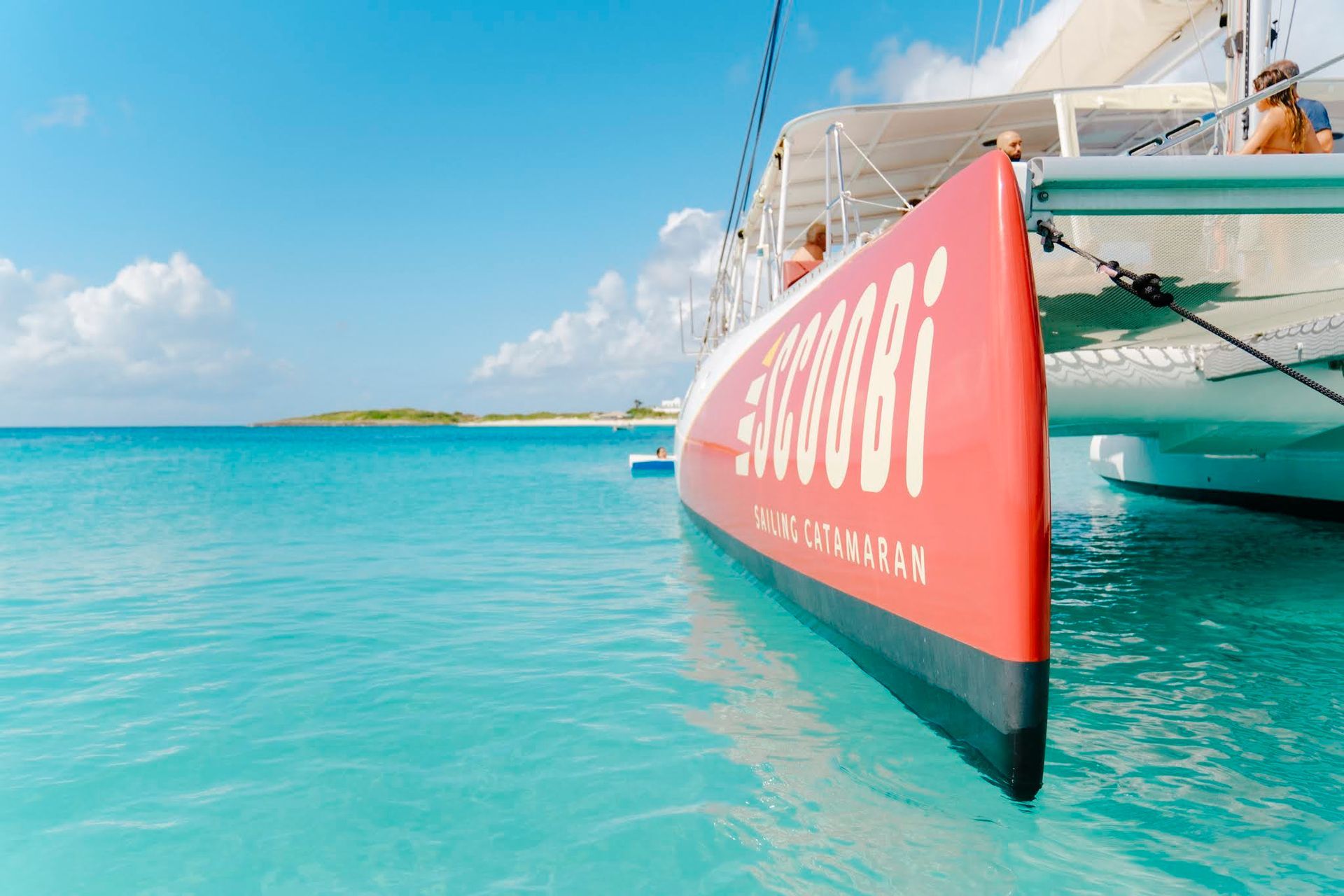 Red-hulled sailboat 