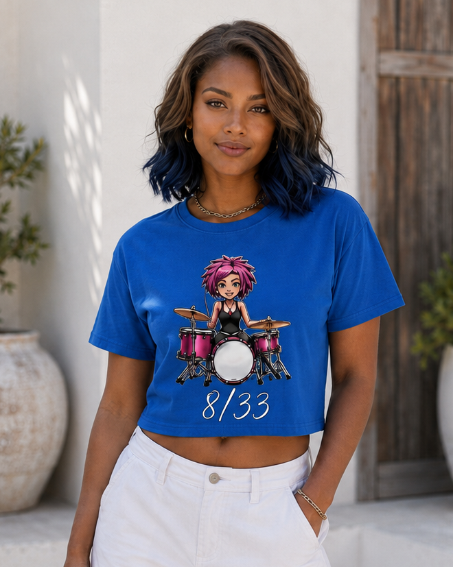 Woman modeling a navy cropped T-shirt with a cartoon graphic and “8/33” text