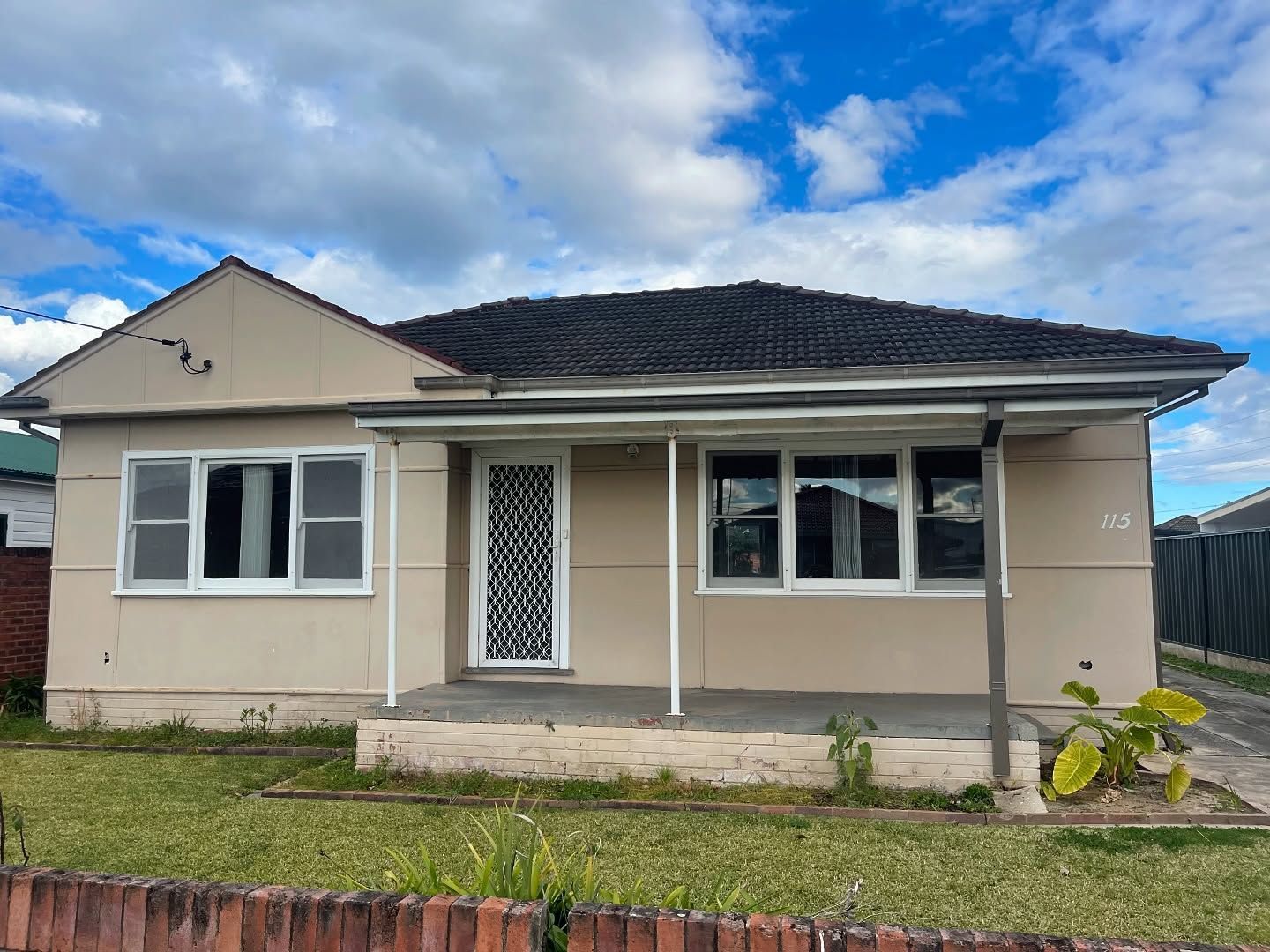 Beige Single-story House With a Small Porch and Dark Roof — Ecowave Solutions Asbestos Removal In Gosford, NSW