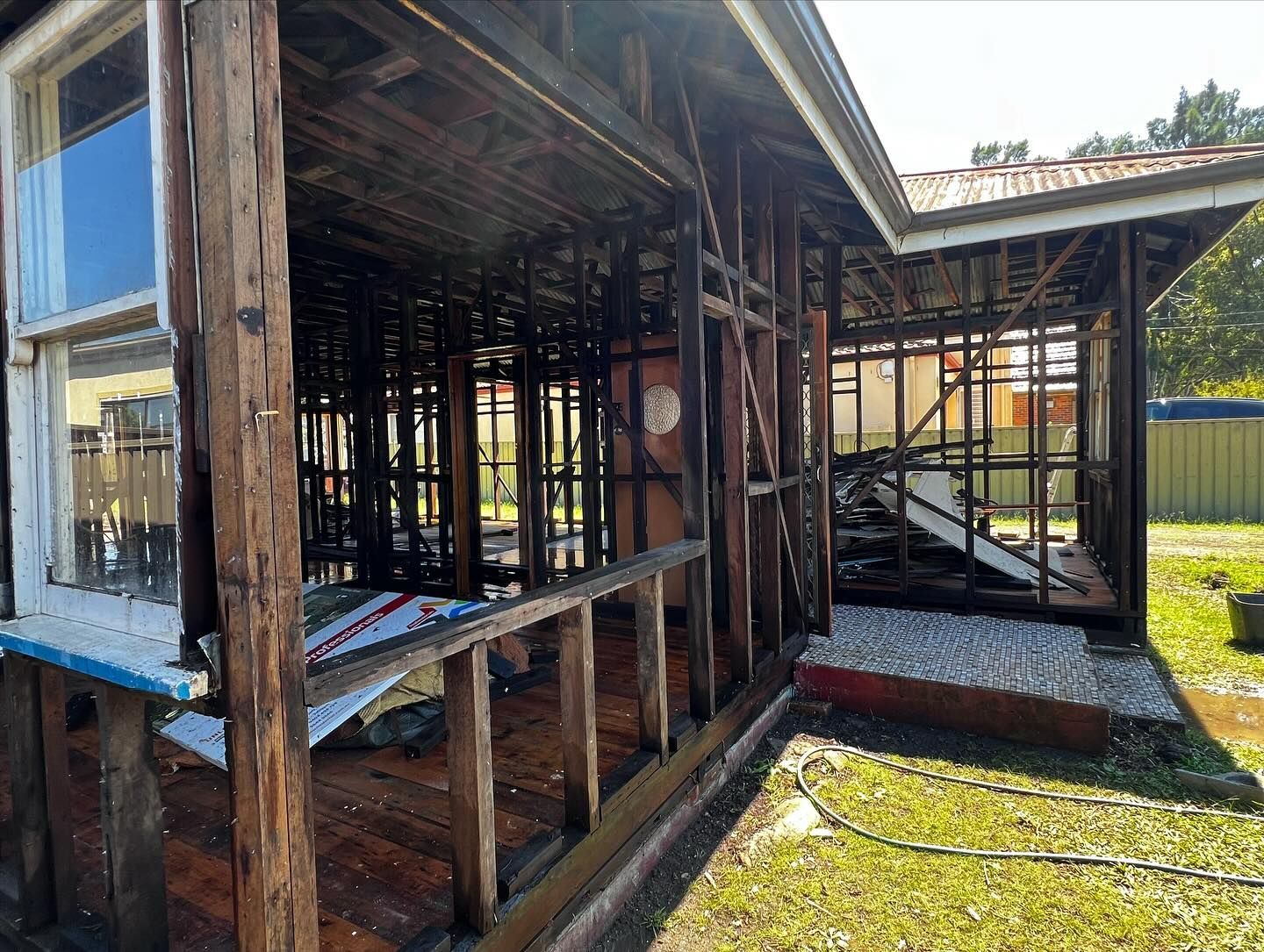 Exterior View of a Partially Burned Wooden House — Ecowave Solutions Asbestos Removal In Gosford, NSW