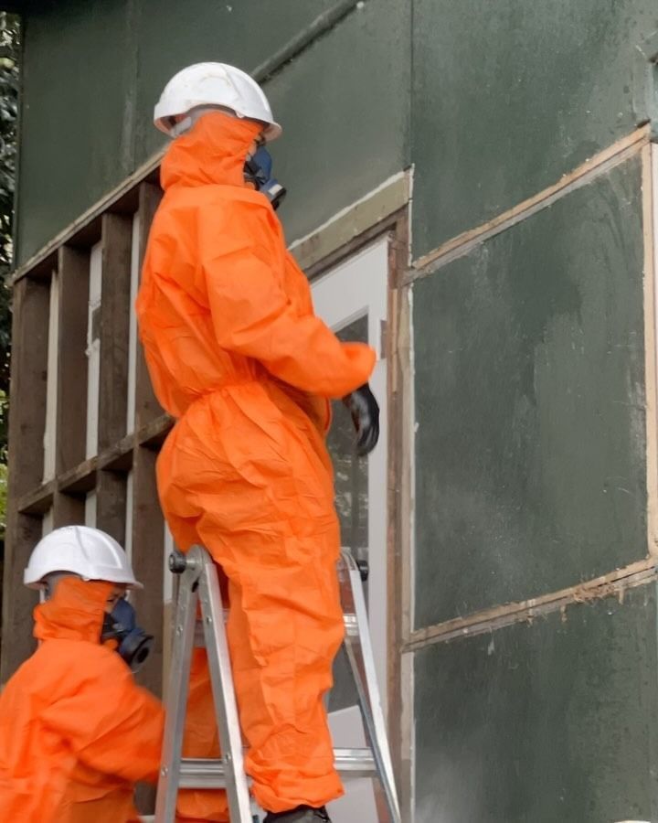 Two People in Orange Protective Suits and White Helmets — Ecowave Solutions Asbestos Removal In Sydney, NSW