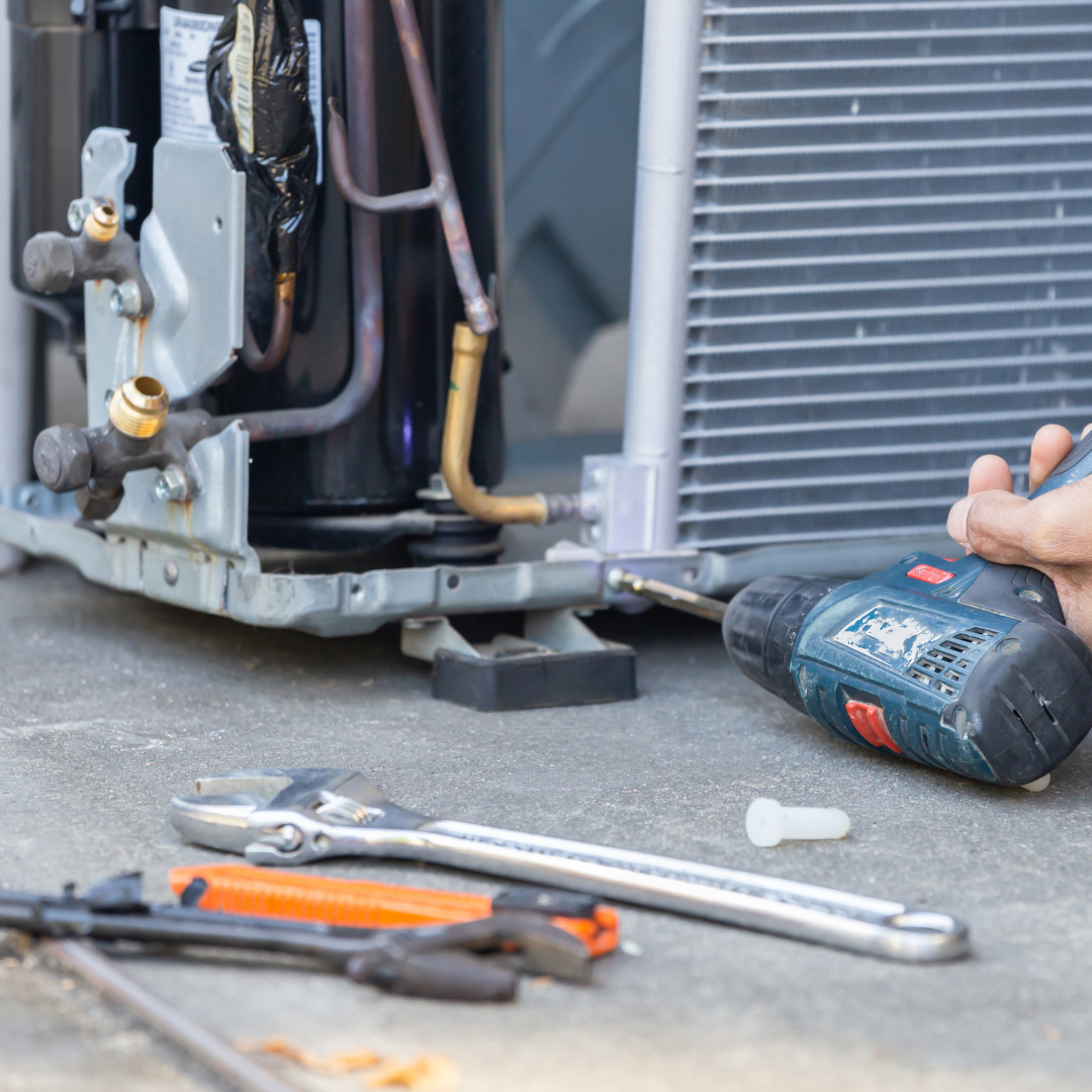 Maintenance professional conducting HVAC repairs