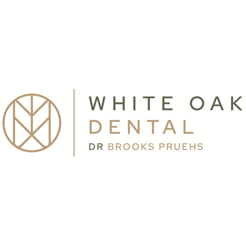White Oak Dental logo in gold and gray with circular monogram and Dr. Brooks Pruehs text