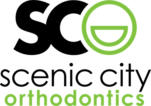 Scenic City Orthodontics logo in black and green with stylized smiling face icon
