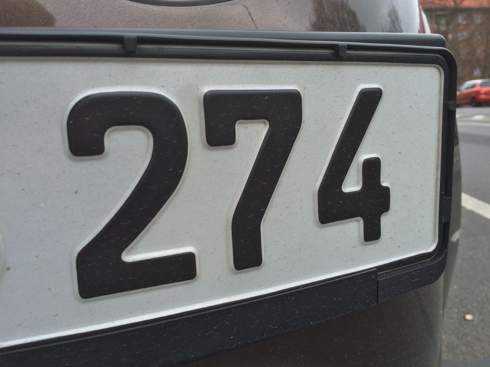 A license plate with the number 274 on it