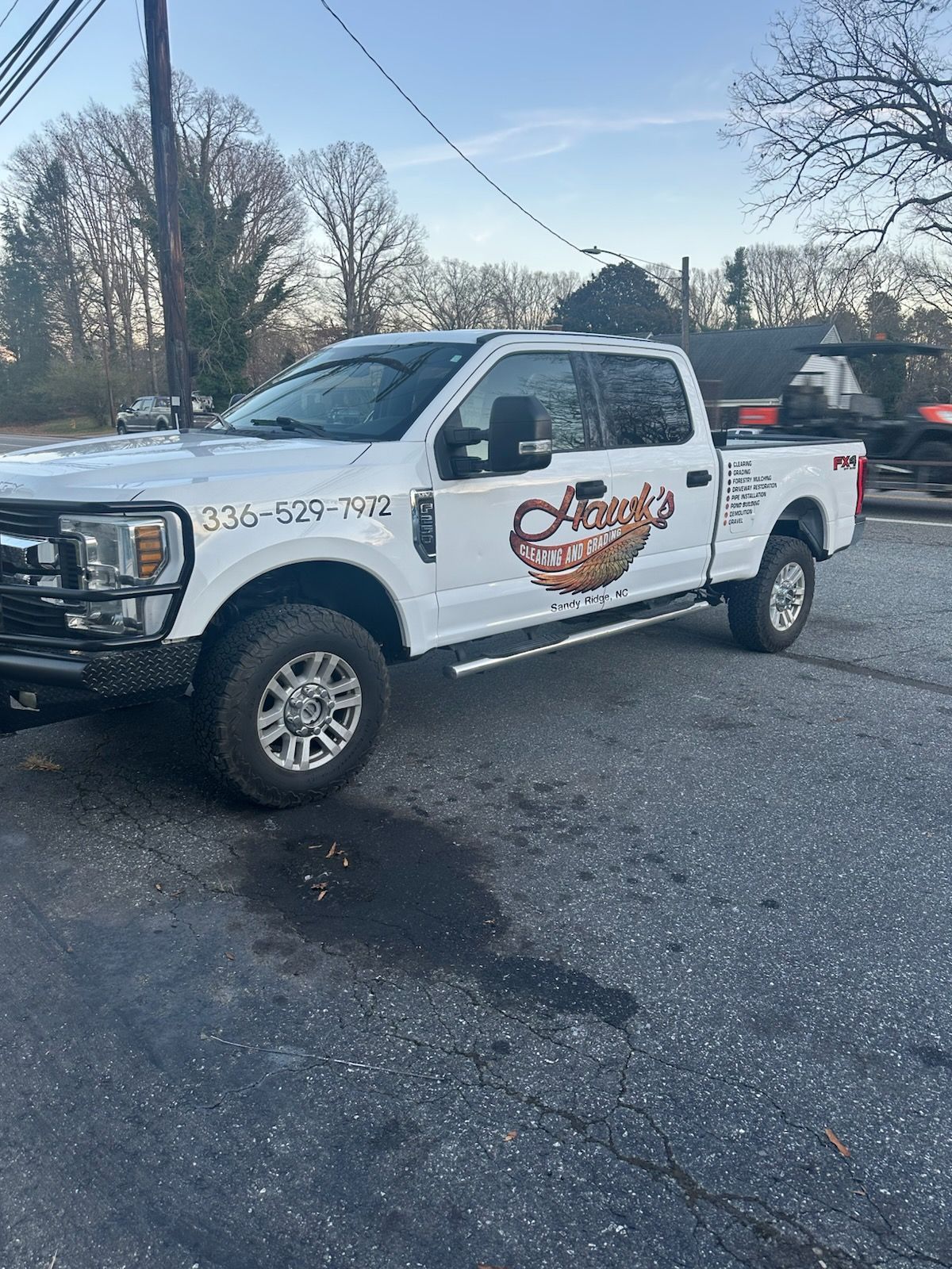A white Ford pickup truck with 