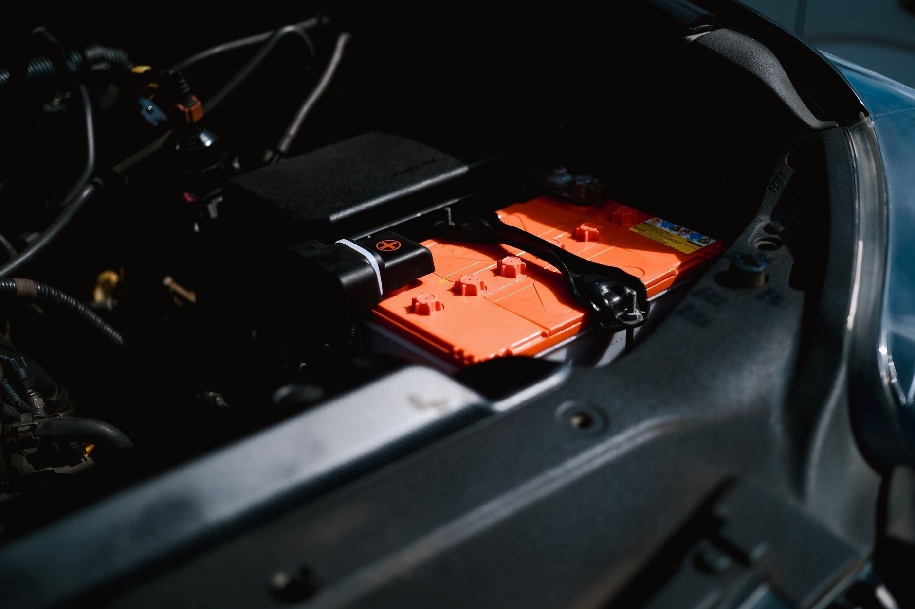 Car battery in an open engine bay, ready for a pre-winter battery test
