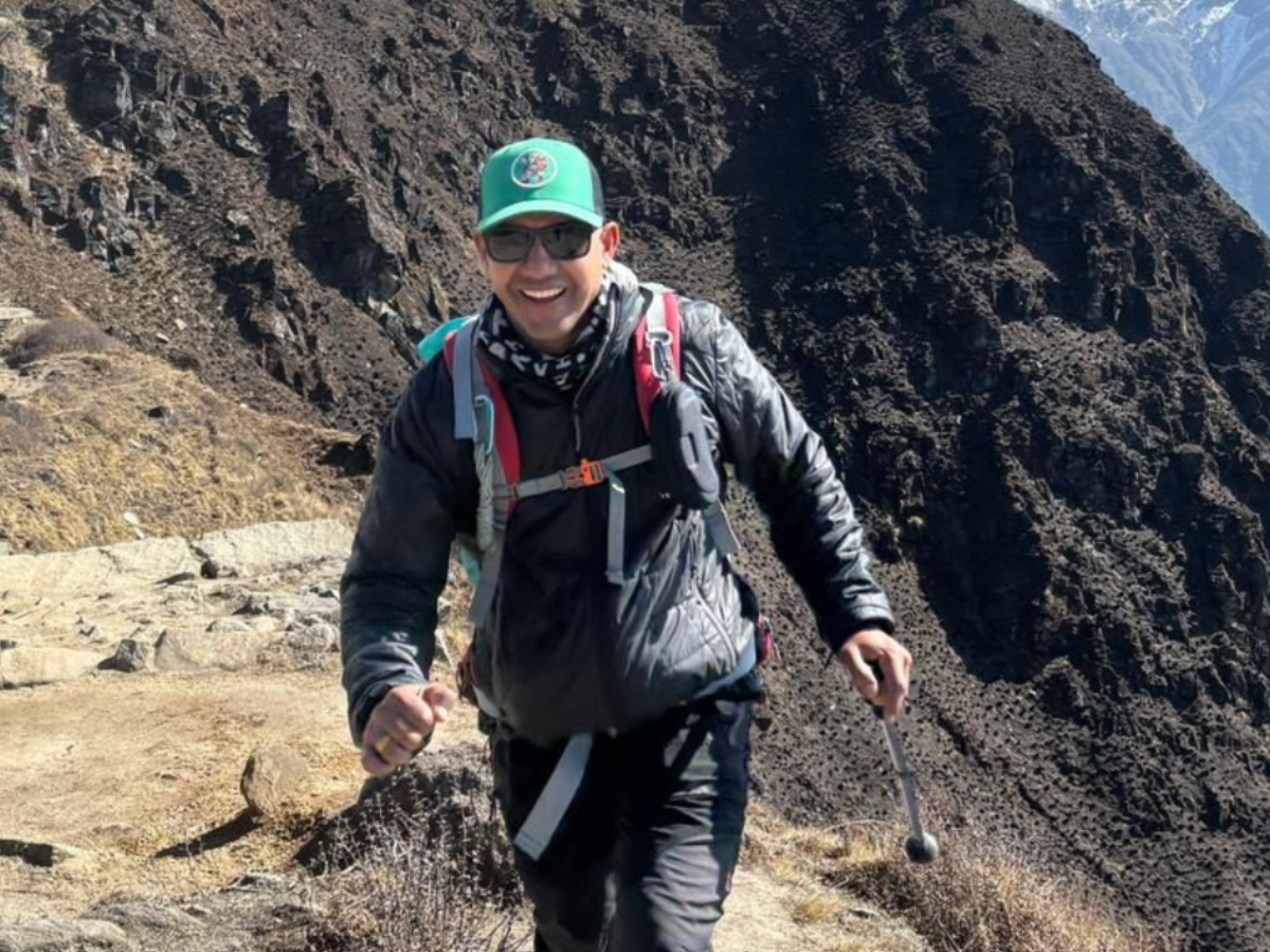 Trekking guide hiking on a mountain trail in the Annapurna region, Nepal
