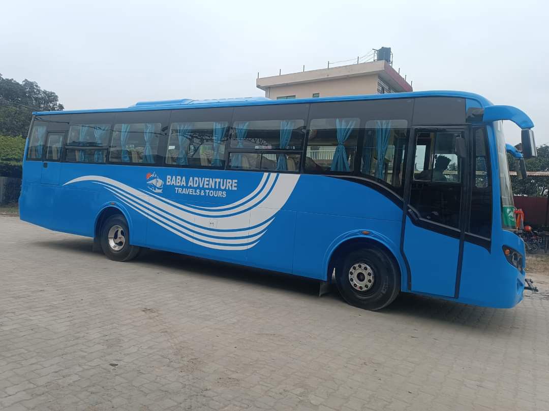 A blue tourist bus parked, showcasing transport options to Pokhara for trekkers and travelers exploring the region.