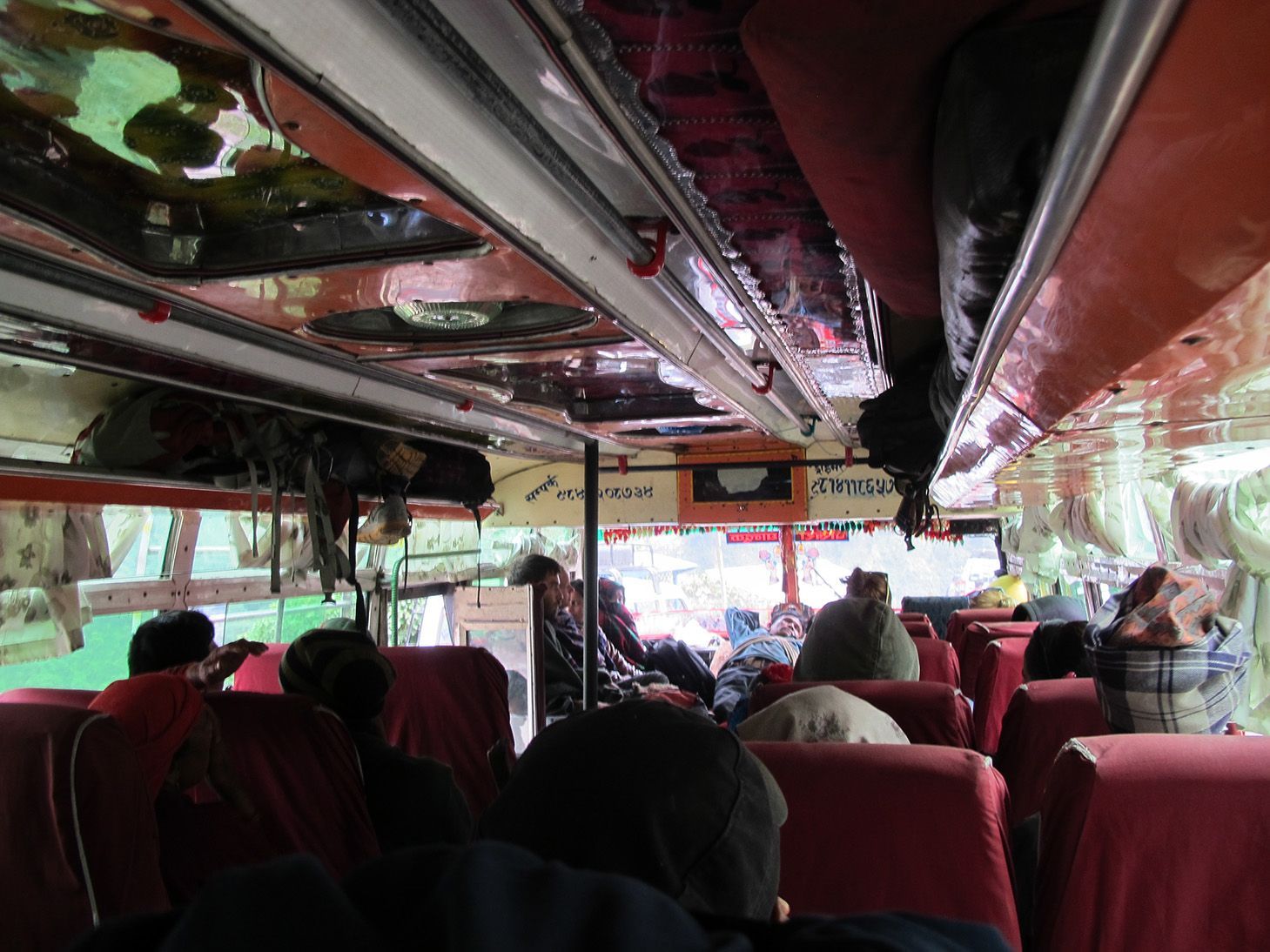 Inside a local bus, featuring seating for passengers on their journey from Kathmandu to Pokhara in Nepal.