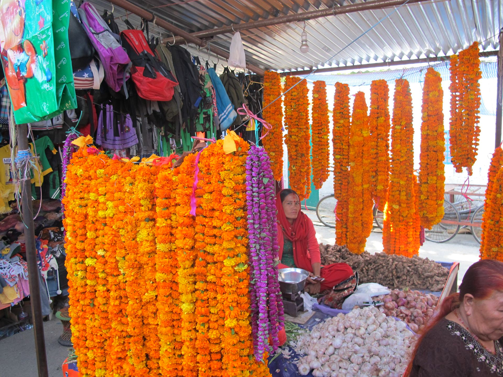 Marigold and makhamali garlands for sale at a market in Nepal before Tihar