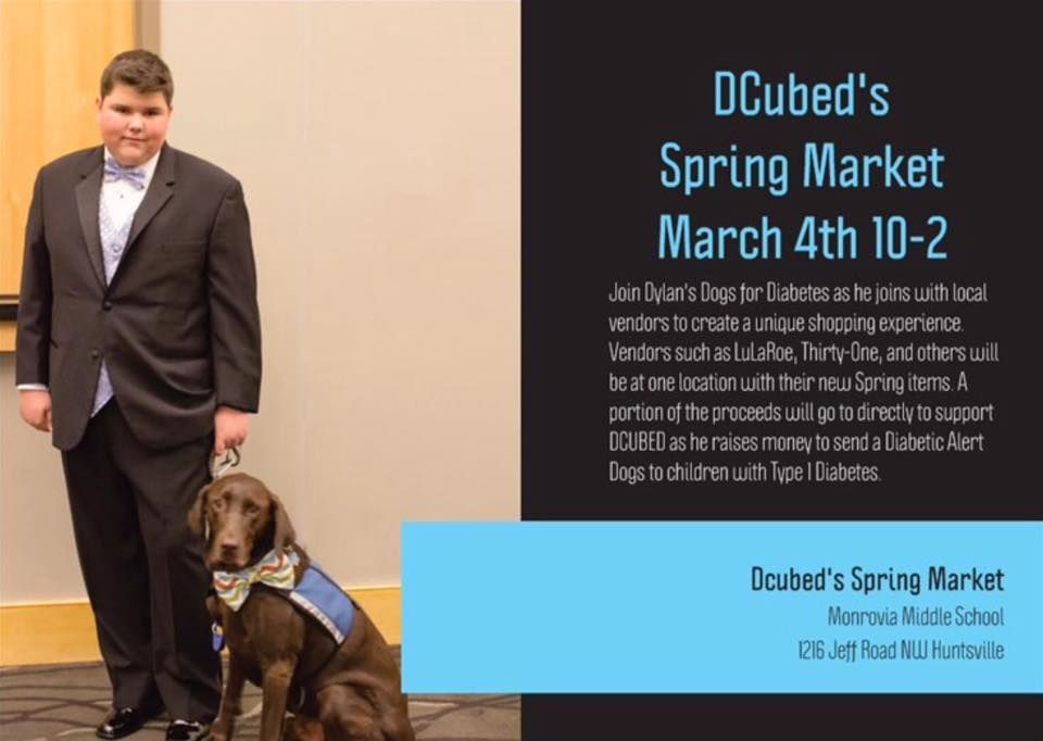A young person in a suit stands next to a service dog at DCubed's Spring Market event at Monrovia Middle School.