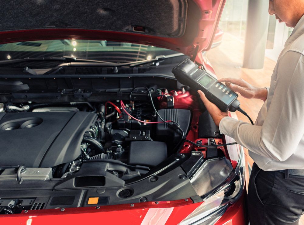 Man Servicing The Car For Maintenance — Crossway Wreckers & Mechanical In Gordonvale, QLD
