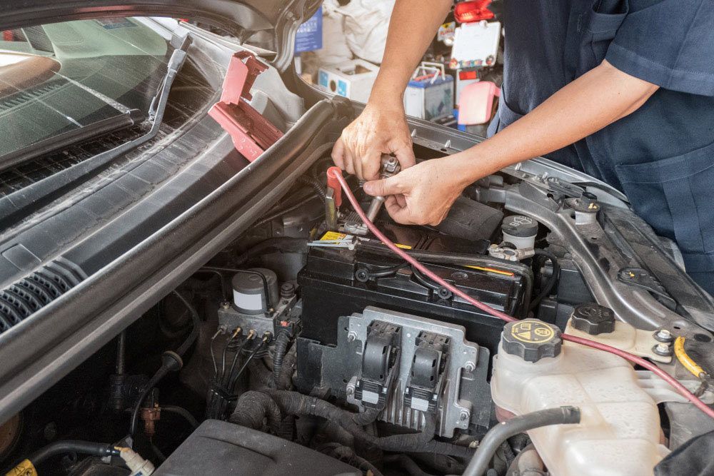 Auto Mechanic Repairing In A Engine Car — Crossway Wreckers & Mechanical In Gordonvale, QLD