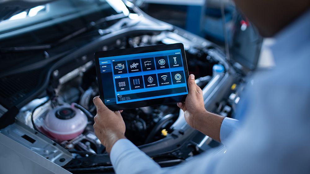 Specialist Inspecting The Vehicle In Order To Find Broken Components In The Engine Bay — Crossway Wreckers & Mechanical In Gordonvale, QLD