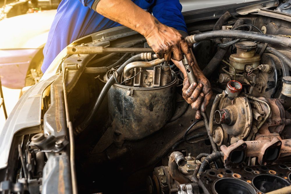 Mechanic Hands Repairing And Overhaul The Engine — Crossway Wreckers & Mechanical In Gordonvale, QLD
