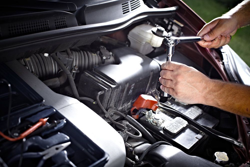Auto Mechanic Repairing Car Engine — Crossway Wreckers & Mechanical In Gordonvale, QLD