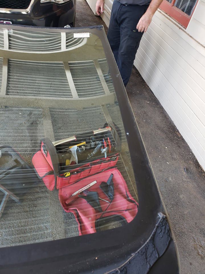 Removing Back Glass Of The Car — Crossway Wreckers & Mechanical In Gordonvale, QLD