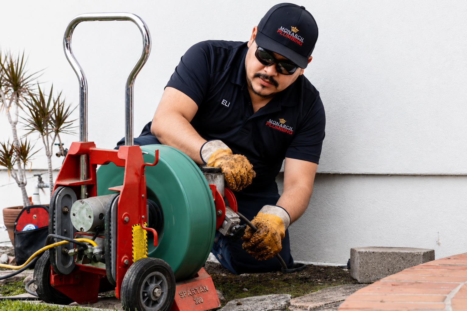 Two workers fixing prepping for drain cleaning service