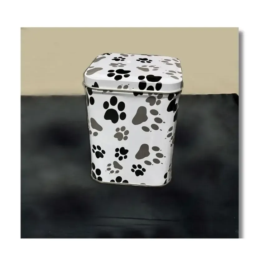 White trash can with paw prints; sits against black and tan background.
