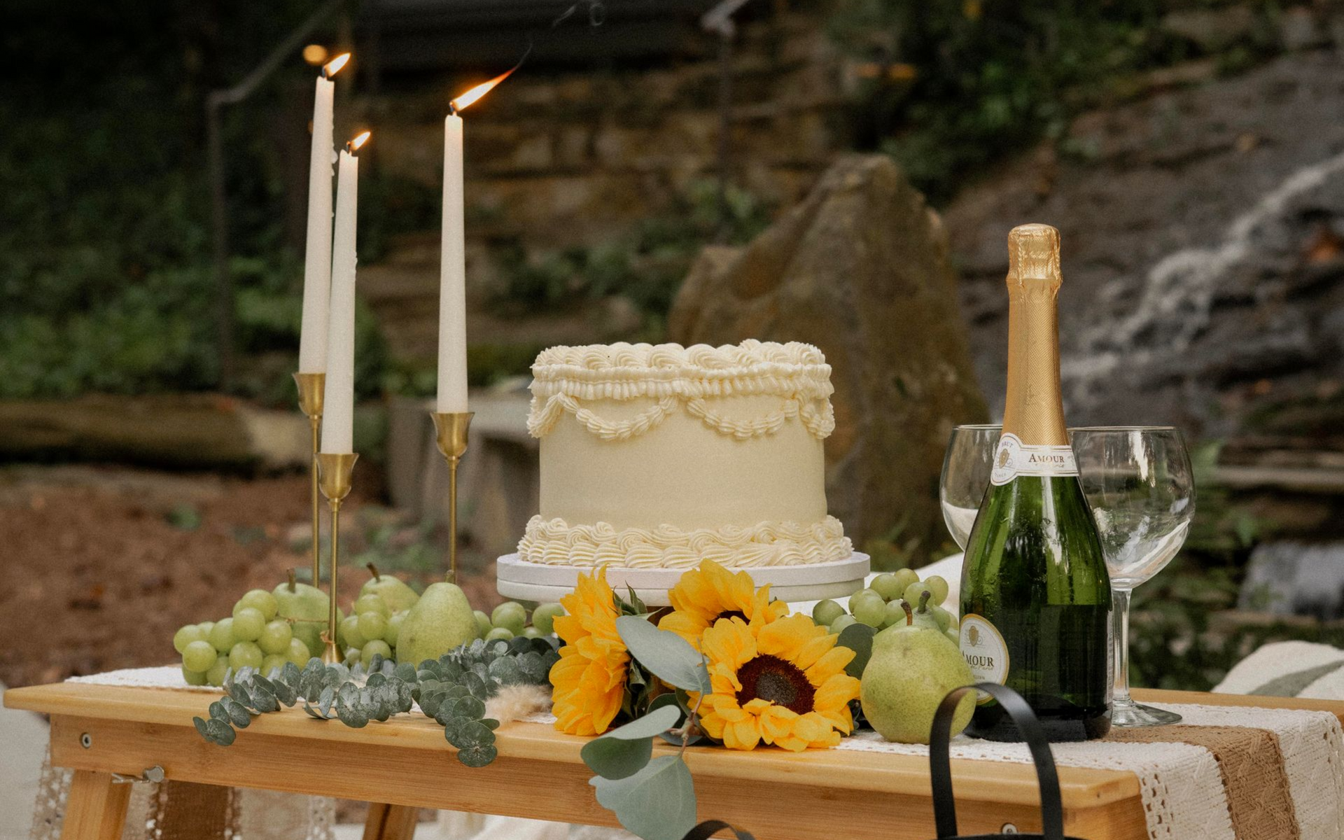 wedding cake with sunflowers around it