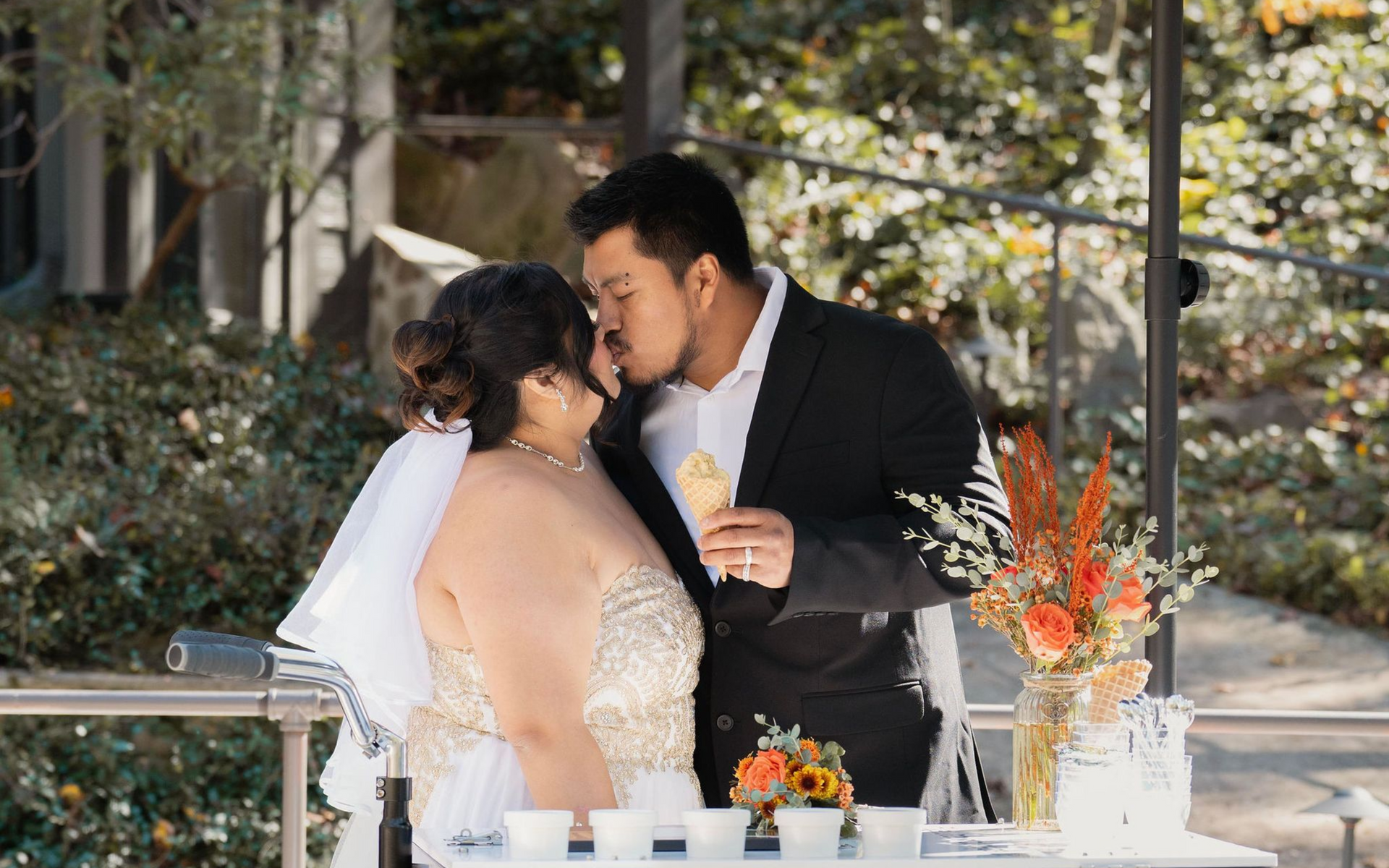 A couple kissing at a wedding