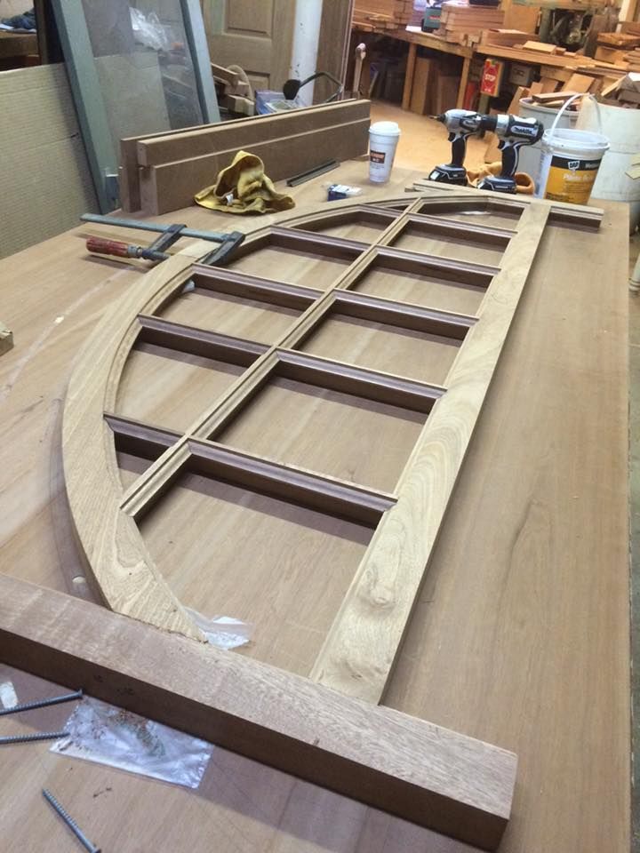 A piece of wood is sitting on top of a wooden table.