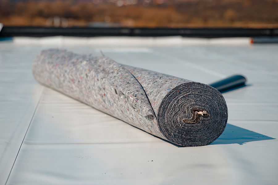 This is an image of standard PVC and felt insulating roofing materials.
