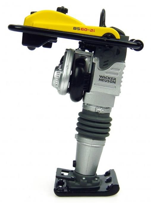A walker miller machine with a yellow cover on it